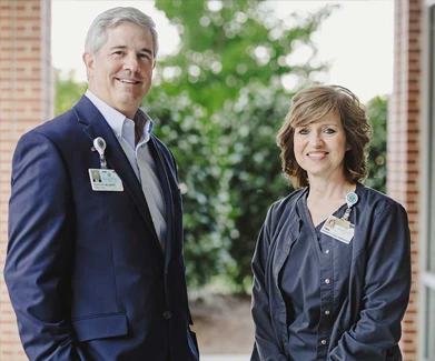 Woman and man standing outside