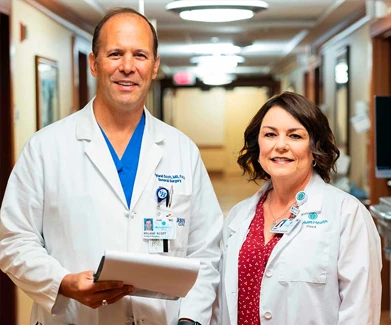 Woman and man in hospital hallway